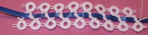 Lace piece with 1/8" blue ribbon