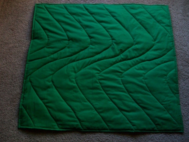 Quilt from the back showing my uneven stitching